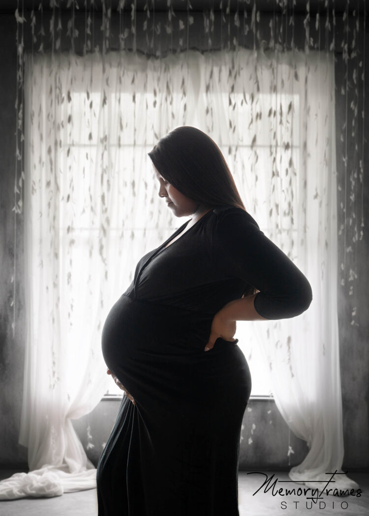 women standing in front of window for maternity phtoshoot, women standing in kitchener studio for maternity photoshoot, guelph maternity photographer