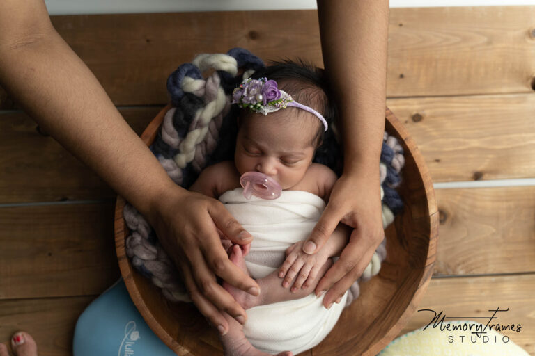 newborn baby posed in a bowl for photoshoot at kitchener newborn studio, kitchener newborn photographer