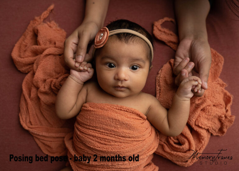 newborn baby holding parents hand for newborn photoshoot in newborn photographers studio, taking newborn photos at home