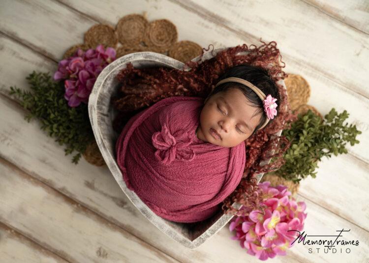 baby posed in heart bowl for newborn photoshoot, beautiful setup for newborn photoshoot in kitchener, newborn photography in kitchener