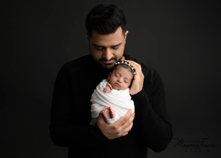 father looking at baby for newborn baby newborn photoshoot, newborn photography kitchener