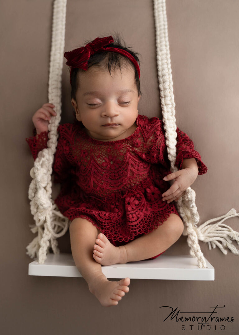 baby on swing for newborn photoshoot, rainbow baby photography, cambridge newborn photography