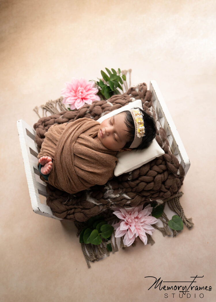 baby posed in kitchener studiio on a prop bed, newborn photography cambridge, newborn photographer cambridge