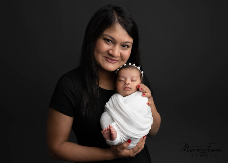 newborn photoshoot kitchener, mother holding daughter for newborn photoshoot